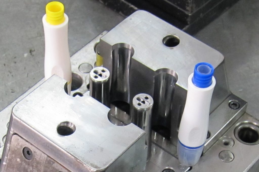 Two-cavity mold for the outer handle.